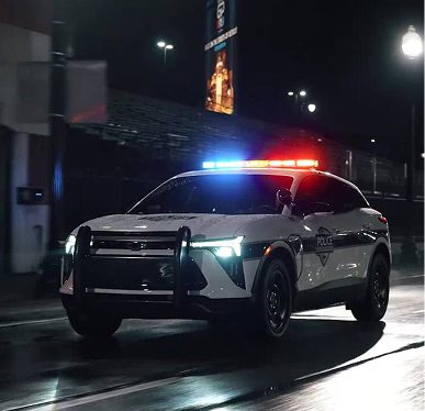 Police car with lights on at night.