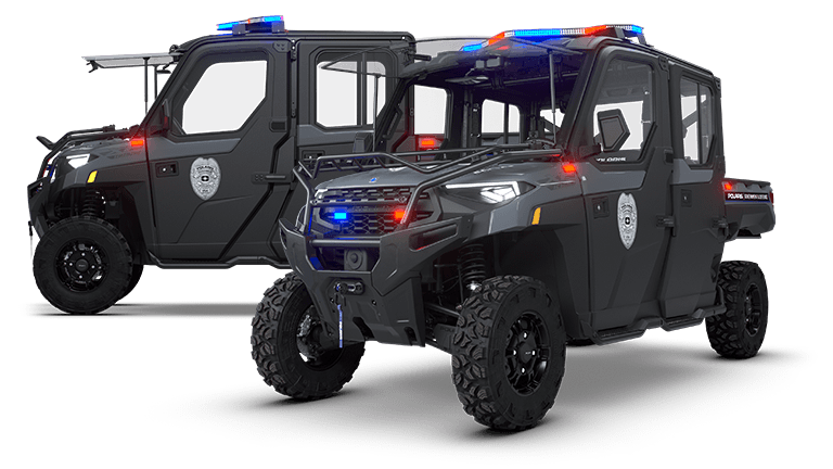 Two black police off-road vehicles with blue lights on top.